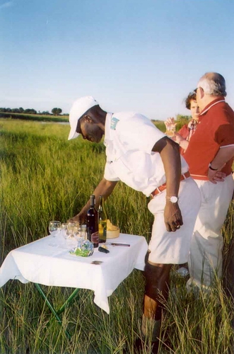 James preparing sundowners at Shinde Camp